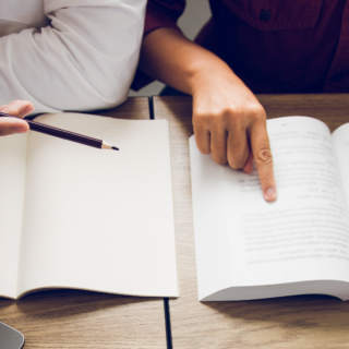 hands reading books